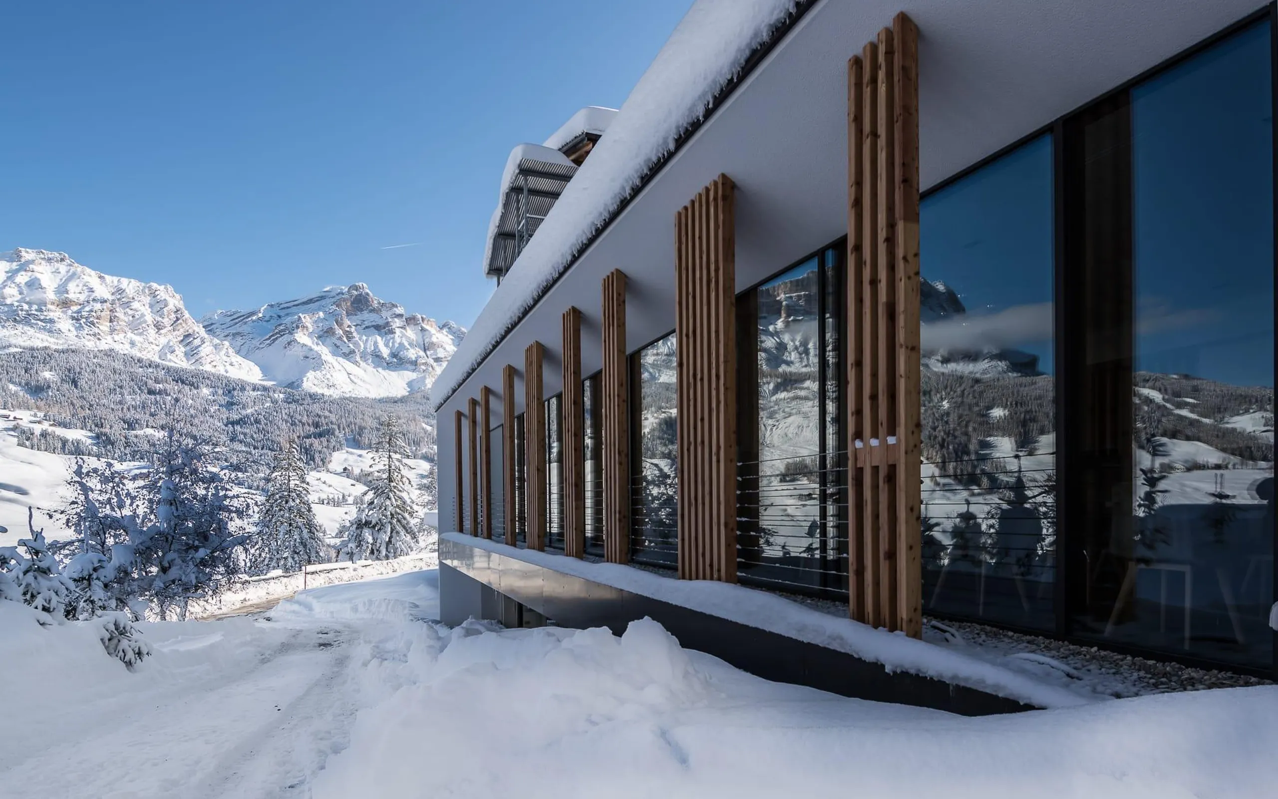 Hotel Lech da Sompunt in La Villa, Alta Badia, showcases modern architecture.